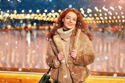 Portrait of a smiling woman in snow