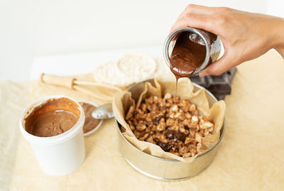 Top view of delicious peanut butter dessert along with dark chocolate dipped rice cakes.