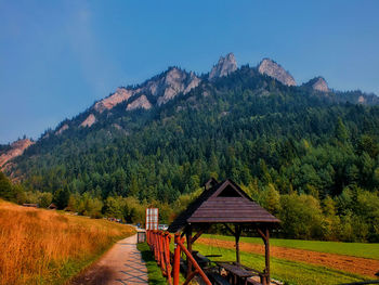 Scenic view of land and mountains against sky