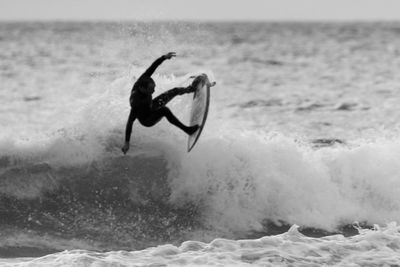 Man splashing water in sea