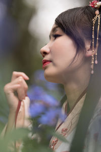 Close-up of young woman looking away