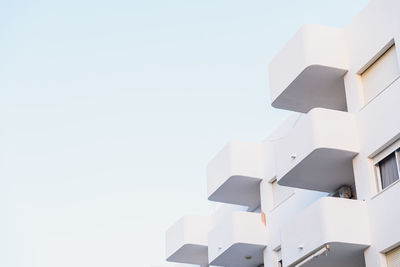 Low angle view of white building against clear sky