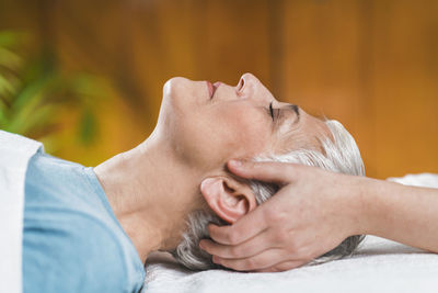Close-up of woman getting massage at spa