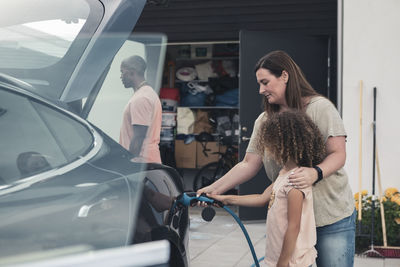 Woman standing in a car