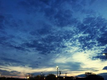 Low angle view of cloudy sky at sunset