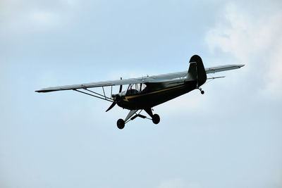 Low angle view of airplane against sky