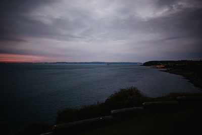 Scenic view of sea against sky at sunset