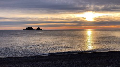 Scenic view of sea against sky during sunset