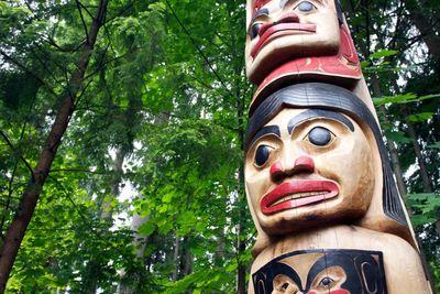 Low angle view of statue against trees