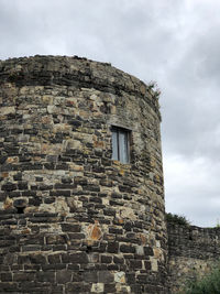 Low angle view of old building against sky