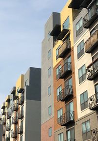 Low angle view of modern buildings against sky