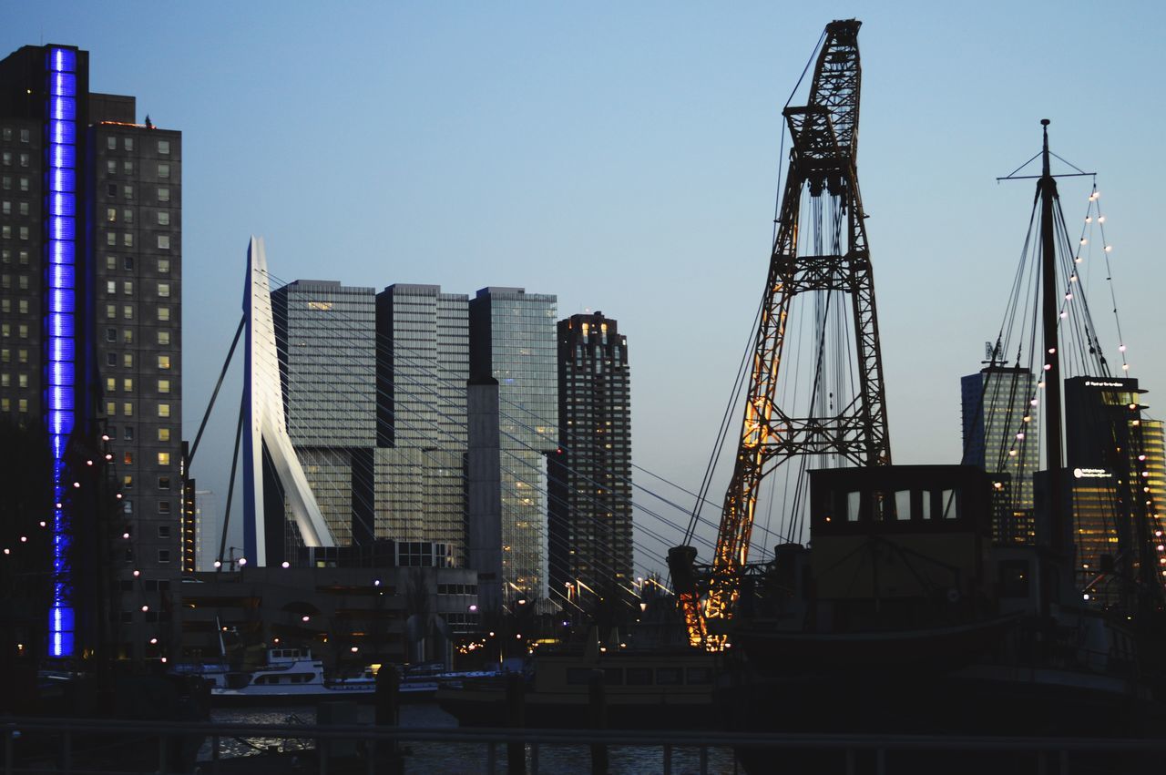 LOW ANGLE VIEW OF ILLUMINATED BUILDINGS AGAINST SKY