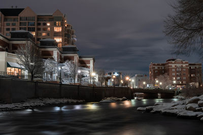 Illuminated buildings in city at night