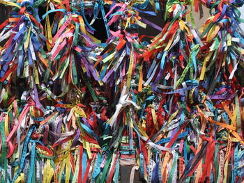 Multi colored prayer ribbons outside temple