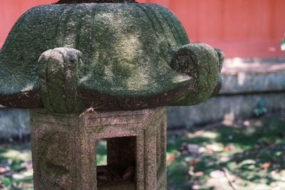 Close-up of stone sculpture in cemetery