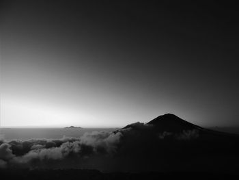 Scenic view of silhouette mountains against clear sky