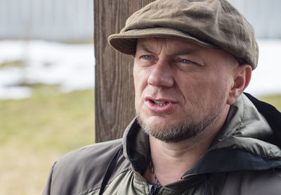 Adult man in cap close-up face