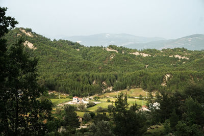 High angle view of trees and buildings against sky