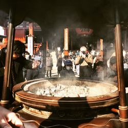 Panoramic shot of people in kitchen