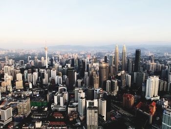 High angle view of city buildings against sky