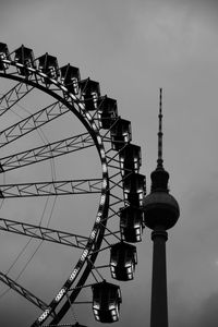 Low angle view of ferris wheel against sky