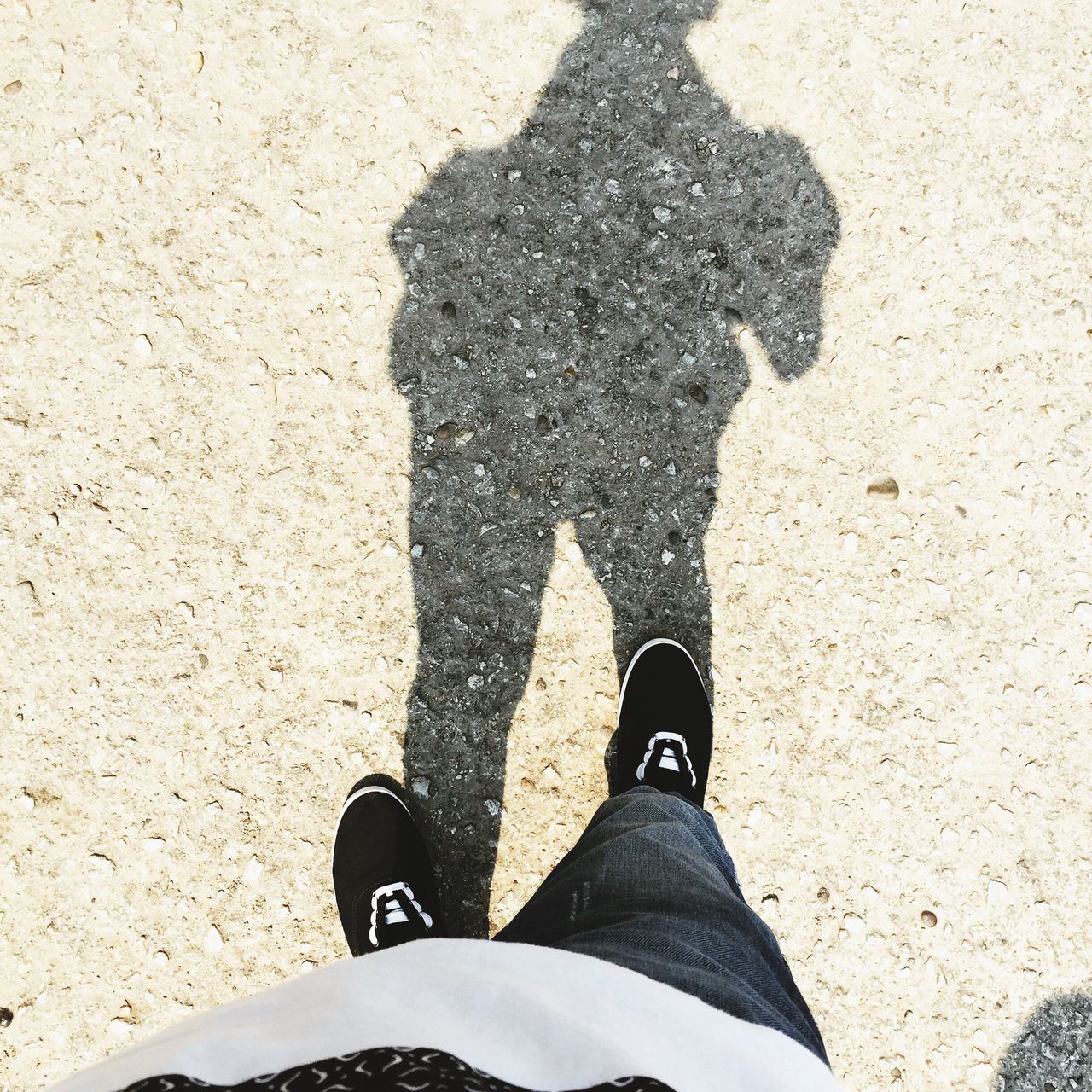 low section, person, personal perspective, shoe, standing, lifestyles, high angle view, leisure activity, human foot, footwear, men, unrecognizable person, shadow, street, sunlight, outdoors, day