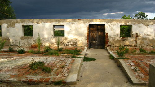 Abandoned building against sky