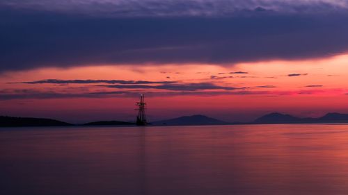 Scenic view of sea against orange sky