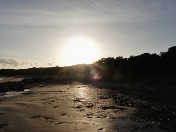Scenic view of sea against sky on sunny day