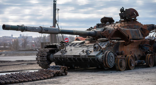 Low angle view of abandoned vehicle