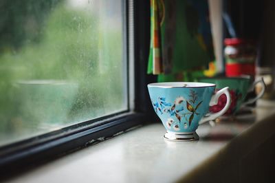 Close-up of coffee cup on table