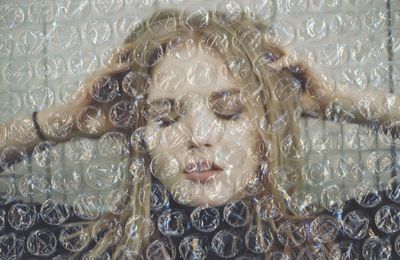 Woman covered in bubble wrap