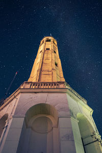 Low angle view of building against sky at night