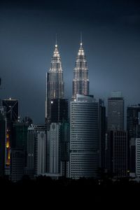 Modern buildings in city against sky