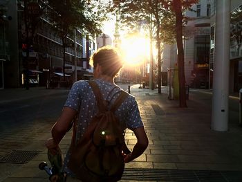 Silhouette of woman standing in city