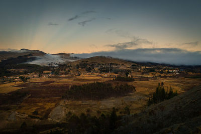 Scenic view of landscape against sky during sunset