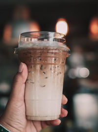 Close-up of hand holding drink