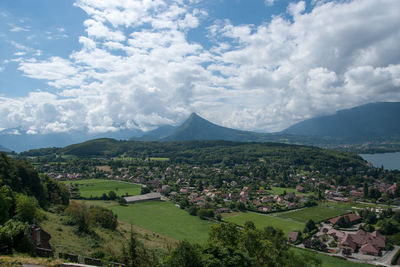 Scenic view of landscape and mountains against sky