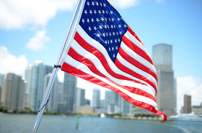 American flag against built structures