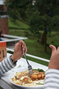 Low section of person holding food