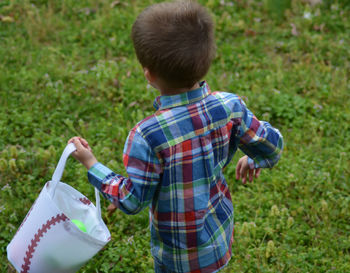 Girl standing on grassy field