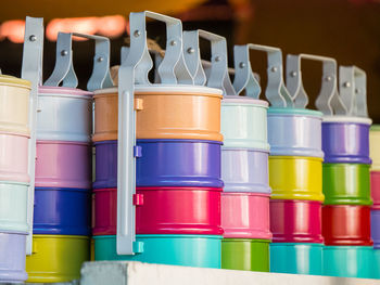 Close-up of multi colored lunch boxes in row