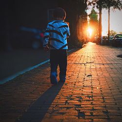 Full length of woman walking on footpath