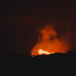 Close-up of bonfire against sky at night