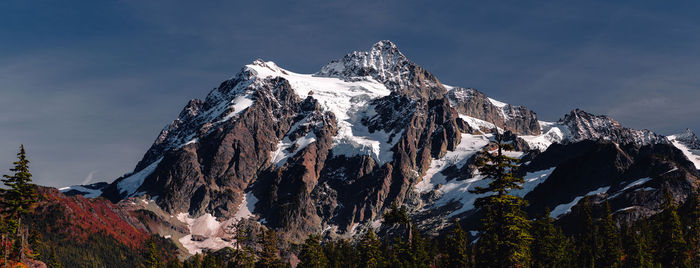 Panoramic view of snowcapped mountains against sky