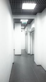 Empty narrow corridor along walls