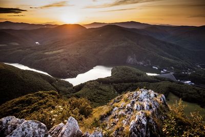 Scenic view of mountains against sky during sunset