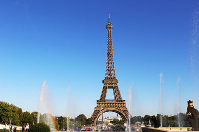 Low angle view of tower against blue sky