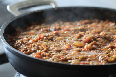 High angle view of meat in cooking pan
