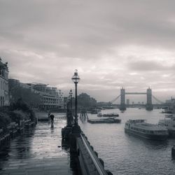 Boats in river with buildings in background